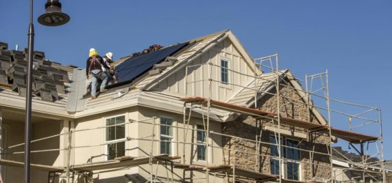 SunStreet workers working on the roof
