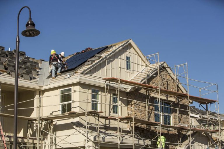 SunStreet workers working on the roof