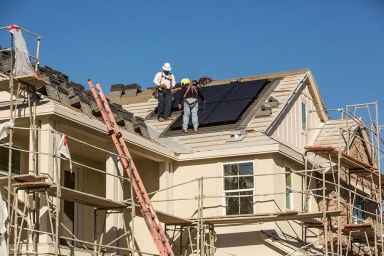 SunStreet workers on the roof