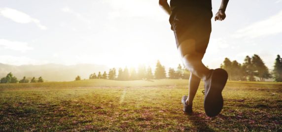 Man running during sunset